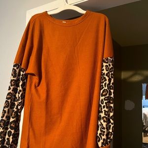 Orange and animal print blouse